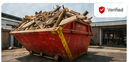 Red skip loaded with building waste